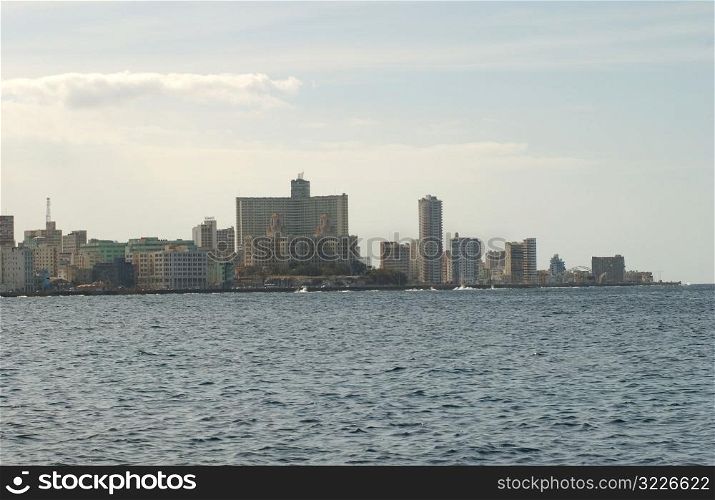 View of the skyline by the sea of an urban city, Havana, Cuba