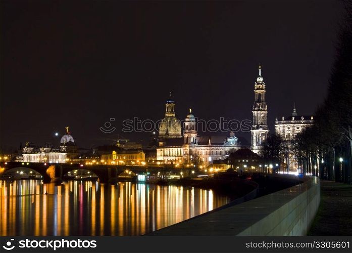 view of the skyline of Dresden at night with the river Elbe