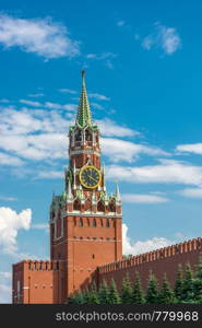 View of the Spasskaya Tower of the Moscow Kremlin against a cloudy sky, Moscow, Russia.