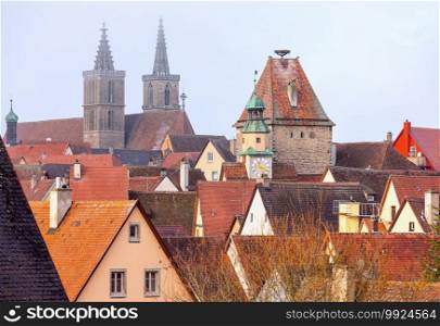 View of the stone towers and medieval buildings in the historic city. Rothenburg ob der Tauber. Bavaria Germany.. Rothenburg ob der Tauber. Old famous medieval city.