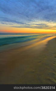 View of the sunset on the pristine tropical beach.