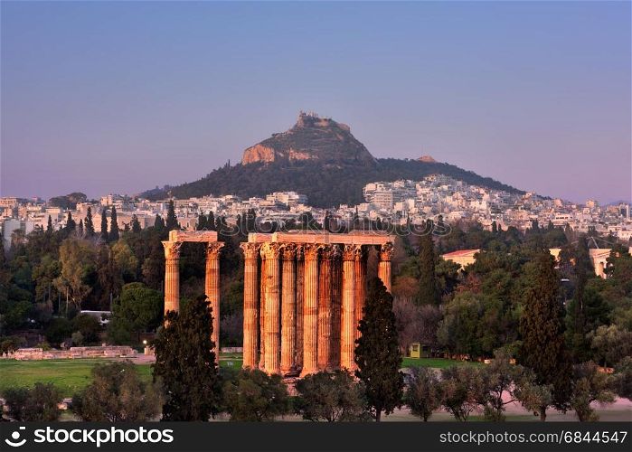 View of the Temple of Olympian Zeus and Mount Lycabettus in the Evening, Athens, Greece