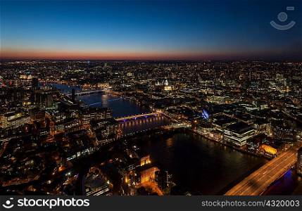 View of the Thames river and bridges at night, London, UK