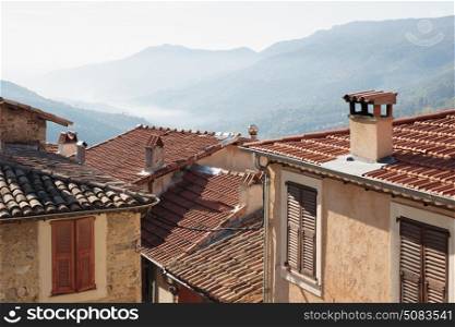 View of the tiled roofs of the old town Coaraze of France