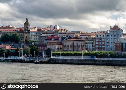View of the town of Portugalete on the riverside, seen from Getxo, Basque Country, Spain