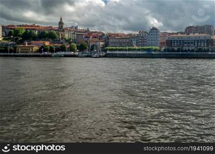 View of the town of Portugalete on the riverside, seen from Getxo, Basque Country, Spain