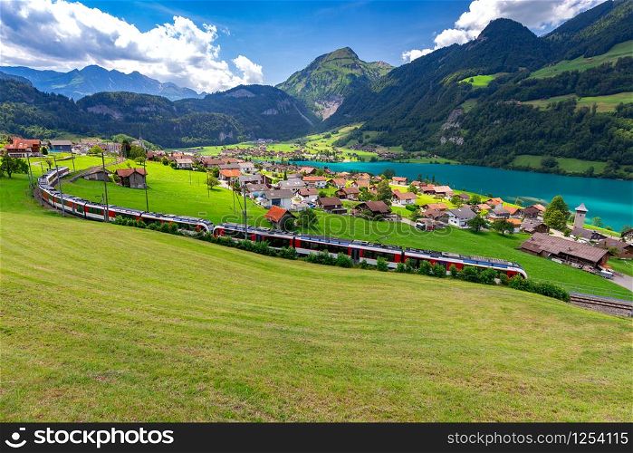 View of the traditional medieval alpine village on a sunny day. Lungern Switzerland.. Lungern Old medieval village in the swiss alps.