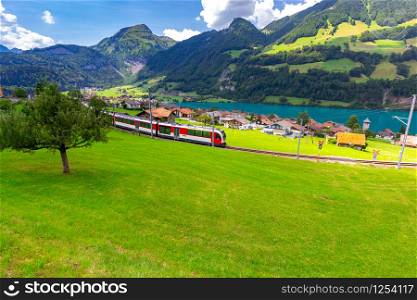 View of the traditional medieval alpine village on a sunny day. Lungern Switzerland.. Lungern Old medieval village in the swiss alps.