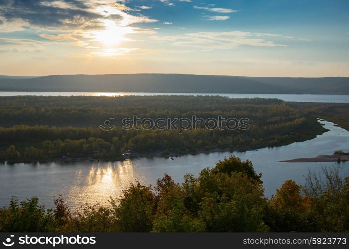 View of the valley of the Volga river from the hill on the sunset