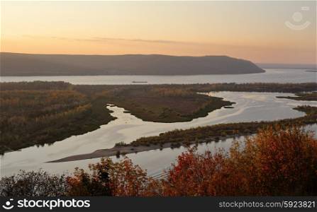View of the valley of the Volga river in autumn at the sunset