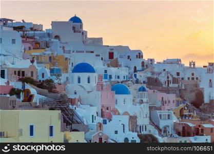 View of the village Oia on the sunset.. Beautiful view of the village Oia on the sunset. Santorini Island, Greece.