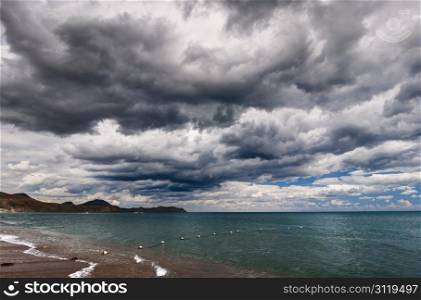 View of thunderstorm clouds above the sea
