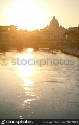 View of Tiber and St. Peter&rsquo;s cathedral at sunset in Rome