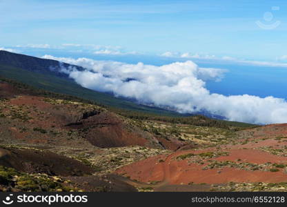 View of top of mountain under blue sky. top of mountain