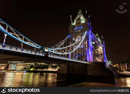 view of Tower Bridge over the River Thames at night, London, UK, England, selective focus