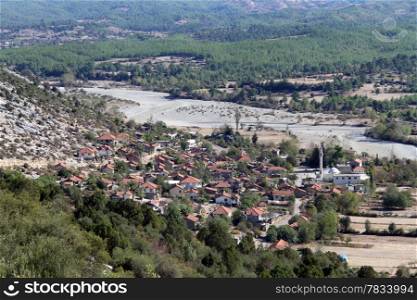 View of turkish village near mount in Turkey