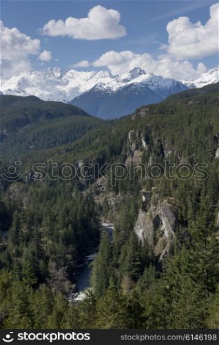 View of valley with mountains against cloudy sky, BC Coast, Coast Mountains, Squamish, British Columbia, Canada