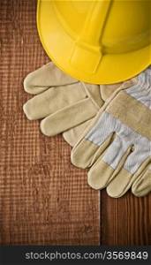 view on a hardhat with gloves on wooden board