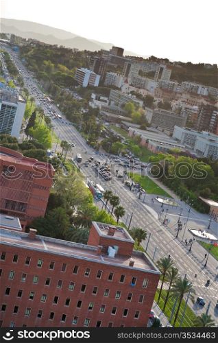view on avenue Diagonal and garden of Pedralbes Royal Palace in Barcelona in evening