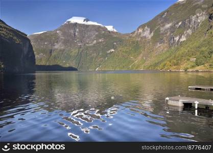 view on beautiful  geiranger fjord in Norway with reflection of mountain in the water