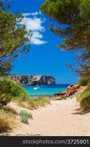 View on Cala Algaiarens from sand pathway to the beach, Menorca island, Spain.