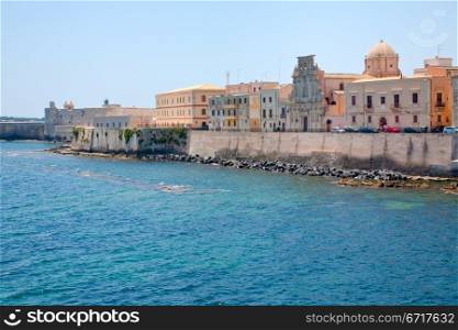 view on Castello Maniace and embankment in Syracuse, Sicily in summer day