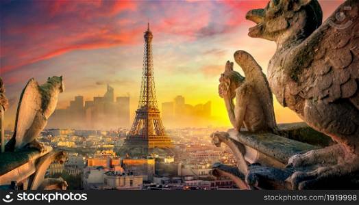 View on Eiffel Tower and chimeras from Notre Dame de Paris, France. Chimeras of Notre Dame cathedral