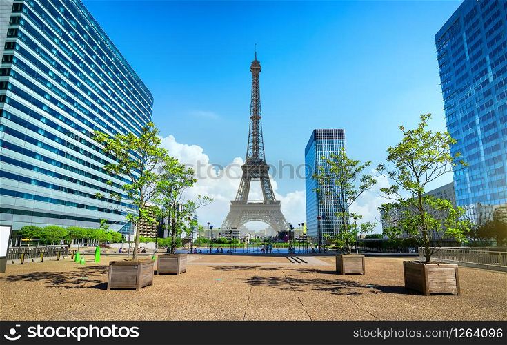View on Eiffel Tower and skyscrapers in modern parisian district La Defence. Eiffel Tower and La Defence