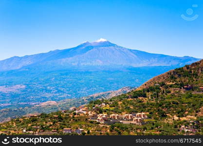 view on Etna and agricultural gardens on flank of hills in Sicily