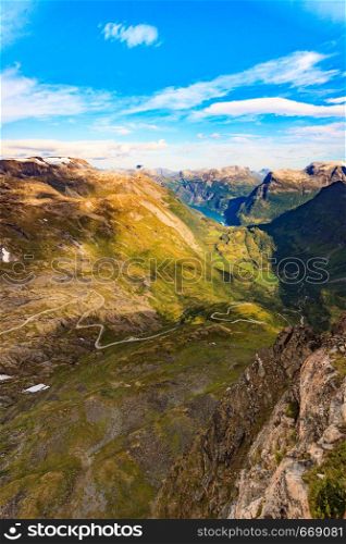 View on fjord Geirangerfjord, mountains landscape and winding road Nibbevegen from Dalsnibba viewpoint, Norway. Tourism vacation and travel.. Geirangerfjord from Dalsnibba viewpoint, Norway