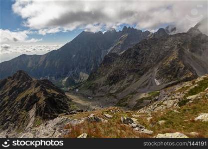 View on high Tatra Mountains with dramatic cloudy sky. View on green lake valle -Zelene pleso.. View on high Tatra Mountains from Jahnaci stit peak, Slovakia, Europe