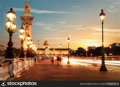 View on Les Invalides from bridge Alexandre III in Paris at sunset, France. Bridge Alexandre III in Paris