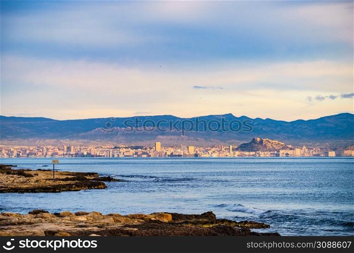 View on mediterranean coast seaside spanish Alicante city on Costa Blanca, Valencia, Spain. View from distance.. Coastal landscape with Alicante city, Spain
