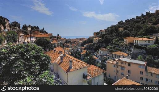 View on Menton city houses and roofs and mediterranean sea, France