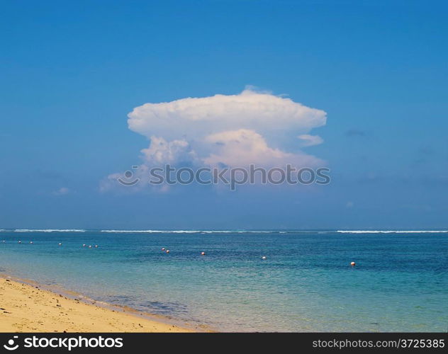 View on ocean with atomic explosion like cloud, Nusa Dua, Bali, Indonesia