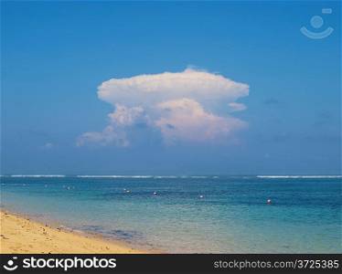View on ocean with atomic explosion like cloud, Nusa Dua, Bali, Indonesia