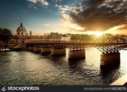 View on Pont des Arts and Institut de France in Paris at sunset