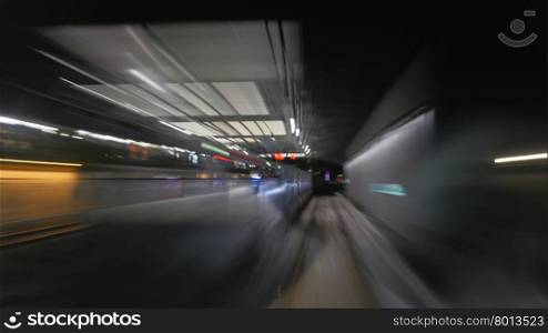 View on reflection of subway tunnel in moving train&amp;#39;s window. Blur
