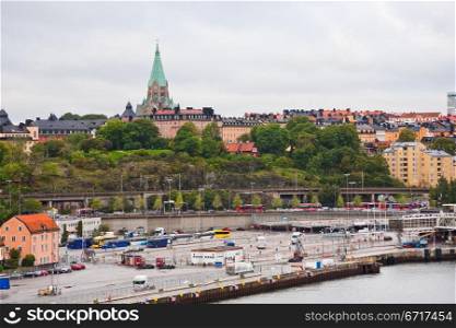 view on shipping terminal and old Sofia Church in Stockholm, Sweden