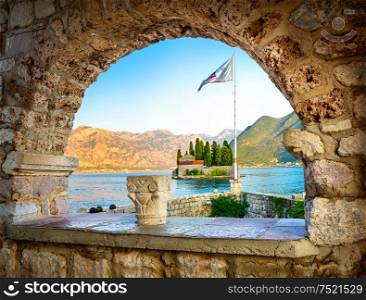 View on St George island from Our Lady of the Rocks through arch. Perast, Montenegro