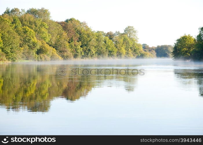 View on the mist on the river early in the morning