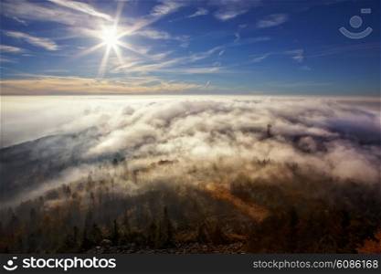 View on the sun over inversion from Jested, Jested-Kozakov ridge, Czech Republic