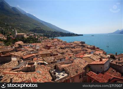 View over Lake Garda over the tiled roofs of Malcesine