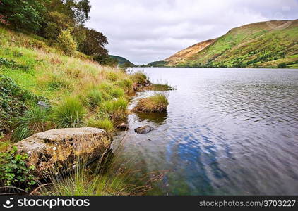 View over Llyn Cwellyn towards mountains in distance in Snowdonia National Park