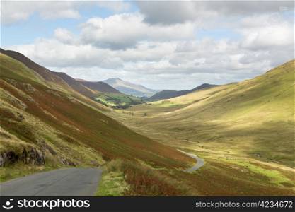 View over Newlands Valley from pass showing steep sided mountains and hills in English Lake District