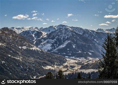 View over the beautiful snow-covered Fassa Valley in the Dolomites from the Rosengarten ski area with the village of Soraga di Fassa. View over the Fassa Valley in the Dolomites from the Rosengarten ski area with the village of Soraga di Fassa