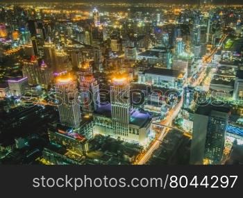 view over the big asian city of Bangkok , Thailand at nighttime when the tall skyscrapers are illuminated