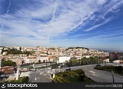View over the old town center and the medieval Saint George Castle from Sao Pedro de Alcantara lookout point in Lisbon, Portugal