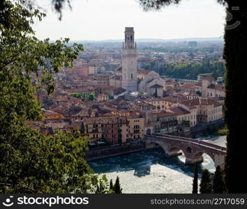 View over the rooftops of Verona, Italy with Cathedral and Ponte Pietra