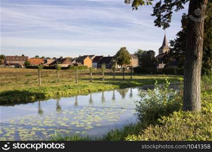 View over the Uffelse brook at Grathem village in the Dutch province Limburg. View at Grathem village
